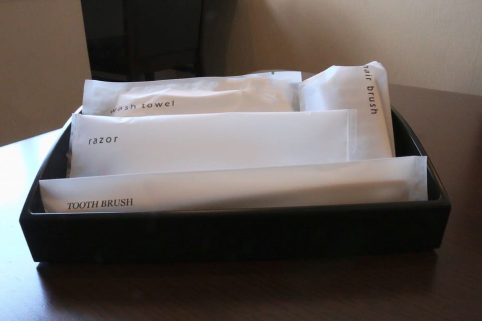 Desk, laptop workspace, bed sheets