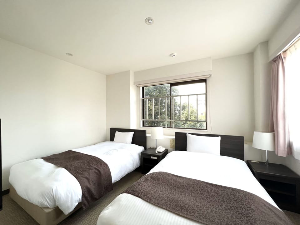 Desk, laptop workspace, bed sheets