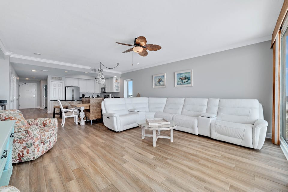 A light-filled living space with captivating views. This inviting room offers a perfect blend of comfort and style, creating a welcoming atmosphere for all.