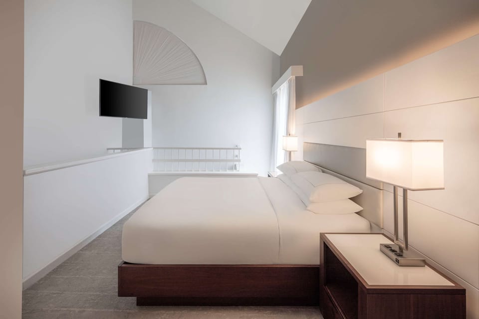 Premium bedding, down comforters, pillowtop beds, in-room safe