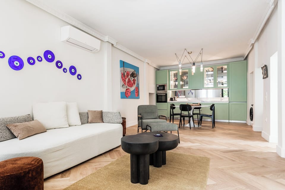 Living room with kitchen in the background