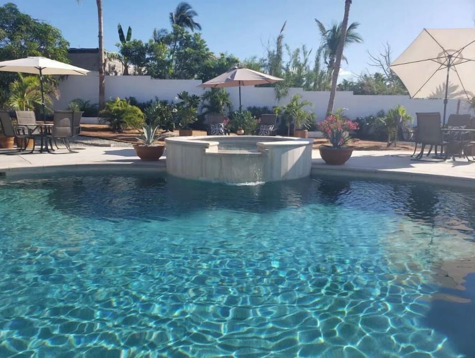 Pool with waterfall from hot tub 