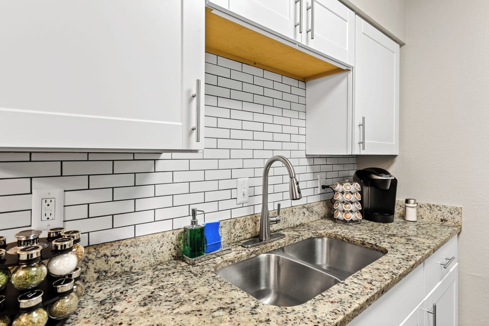 Fully appointed kitchen and with granite counters and stainless appliances