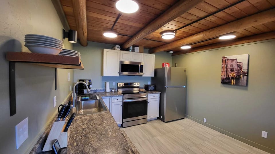 stovetop, refrigerator, indoor, oven, coffee and or coffee maker, microwave