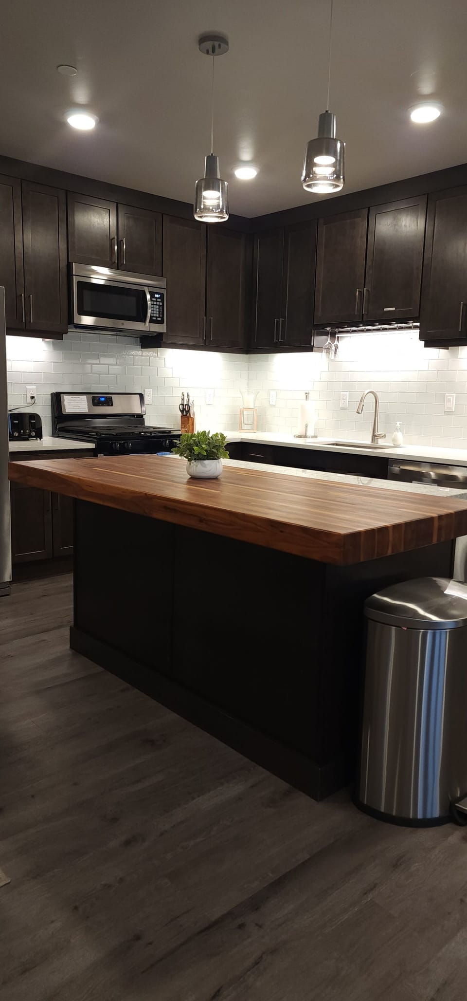The gorgeous kitchen features granite countertops, stainless steel appliances, and everything you'll need to whip up a tasty meal.