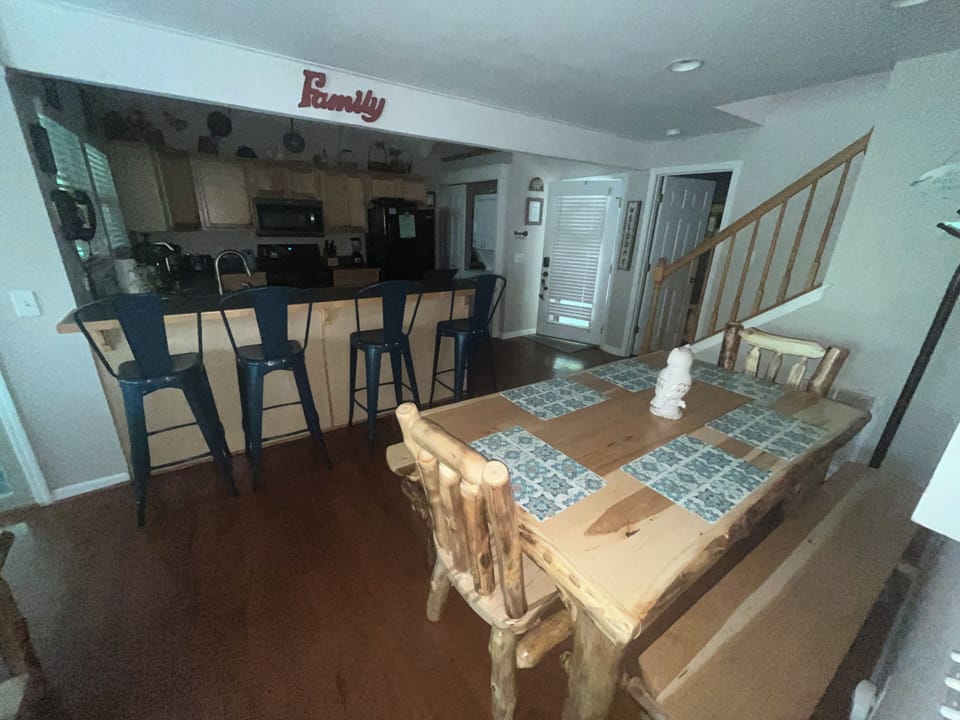 Dining Room table which seats 8 and 4 additional Bar top stools!