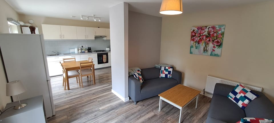Open-plan living and kitchen area — bright, well-equipped