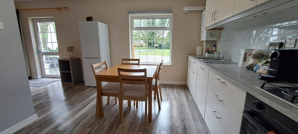 Bright kitchen and dining area with garden views 