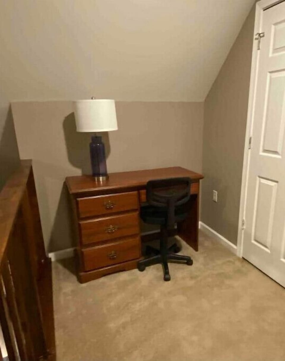 Upstairs - office space located opposite side of stairwell from bunk beds.