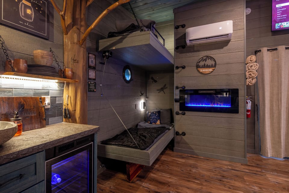 DOUBLE BUNKS - READING LIGHTS - USB PORTS - LUXURY LINENS - LOWER BUNK CRANKS TO REVEAL HIDDEN FEATURE - LED FIREPLACE - DRINK CHUTE