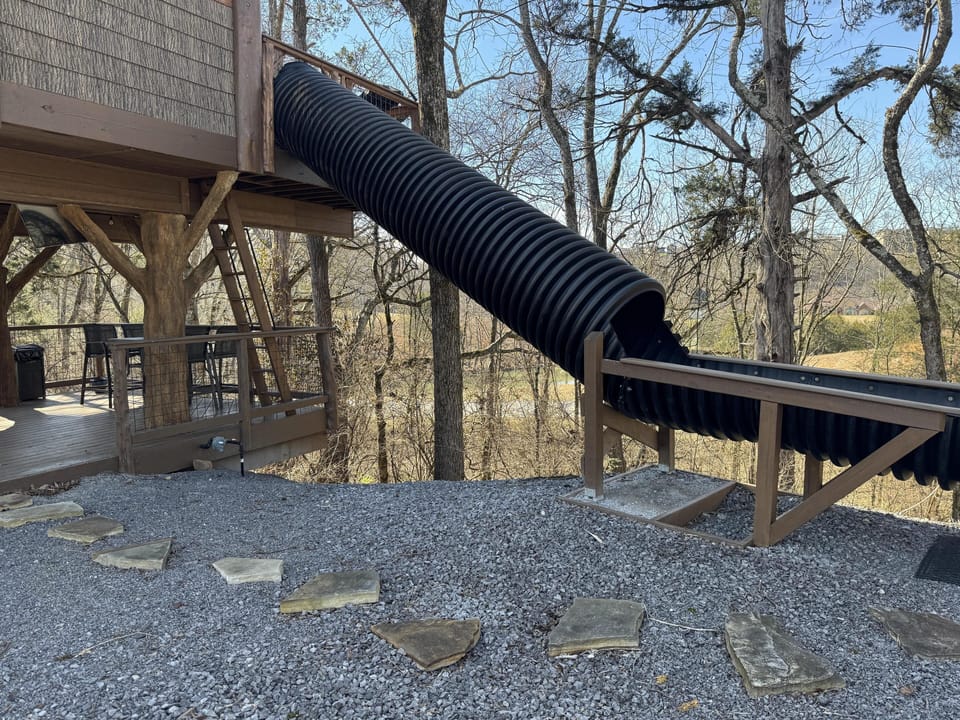 TAKE A TRIP DOWN THE 20-FOOT SLIDE - SQUIRRELS GONE WILD TREEHOUSE - SANCTUARY TREEHOUSE RESORT
