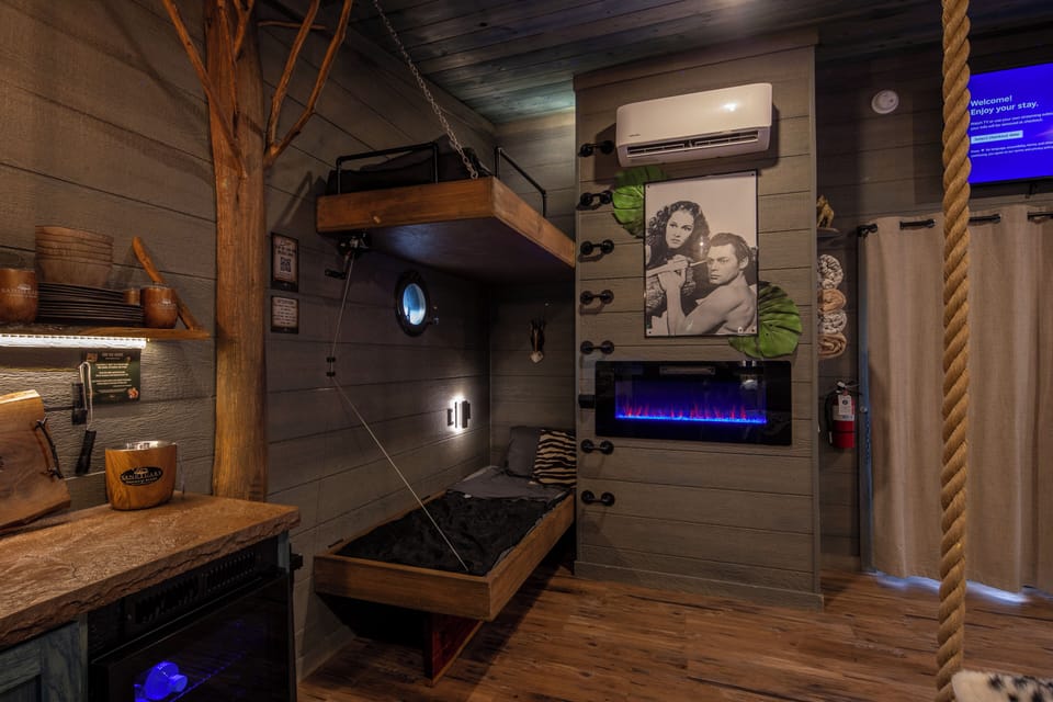 2 SETS OF DOUBLE BUNKS - 2 LED FIREPLACES - CRANK THE LOWER BUNK FOR INTERACTIVE FEATURE - LUXURY LINENS & SLEEPING BAGS PROVIDED 