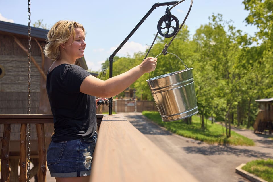 RAISE AND LOWER YOUR FAVORITE DRINKS AND SNACKS WITH OUR BUCKET PULLEY AT TREE-MENDOUS FUN TREEHOUSE
