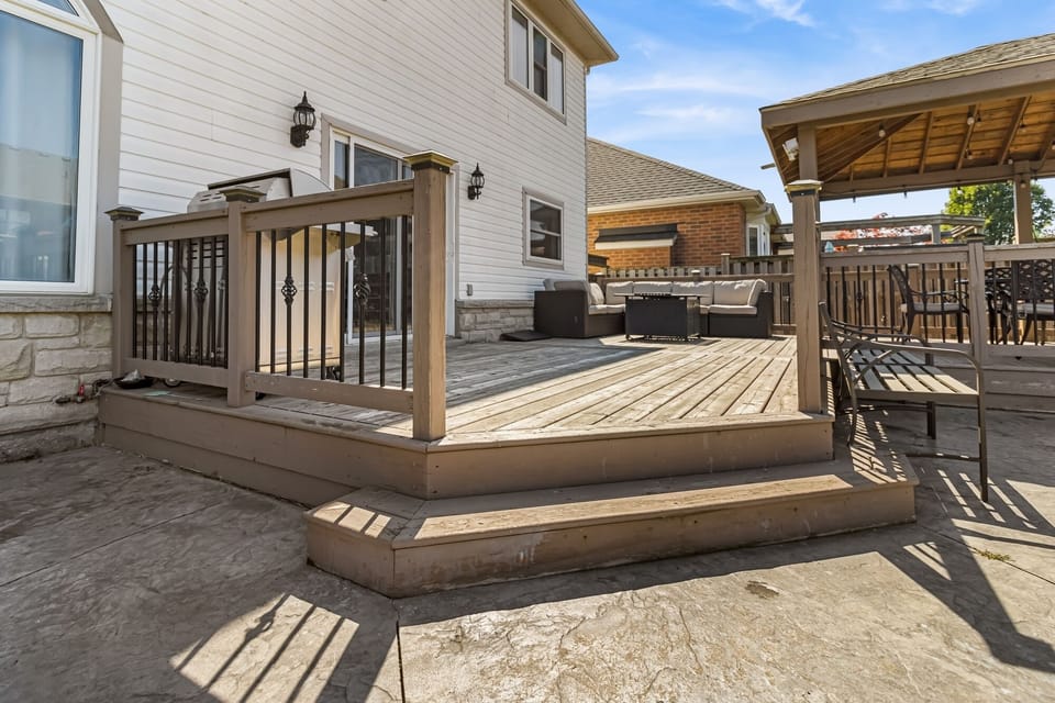 Enjoy relaxing in the backyard oasis with fire pit, BBQ and lots of seating!
