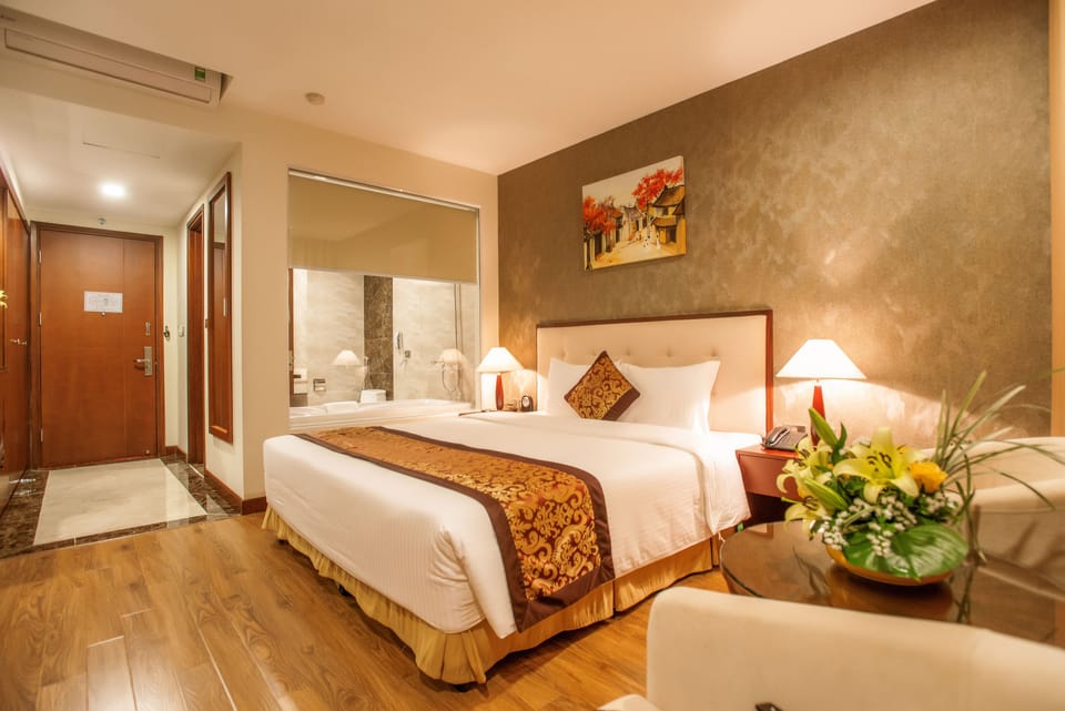 Deluxe Room, 1 King Bed | In-room safe, desk, free WiFi, bed sheets