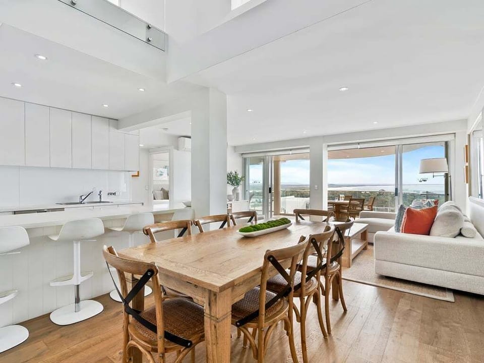 Open plan living, dining and kitchen with a view