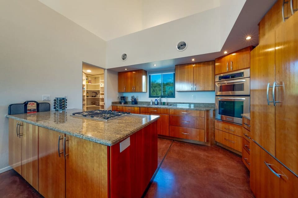 Well-appointed chef`s kitchen with custom cabinets