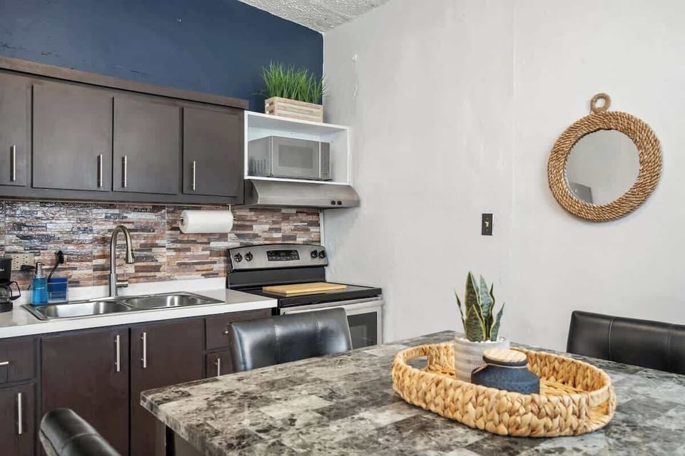 The kitchen has a comprehensive housewares package for full course meal prep