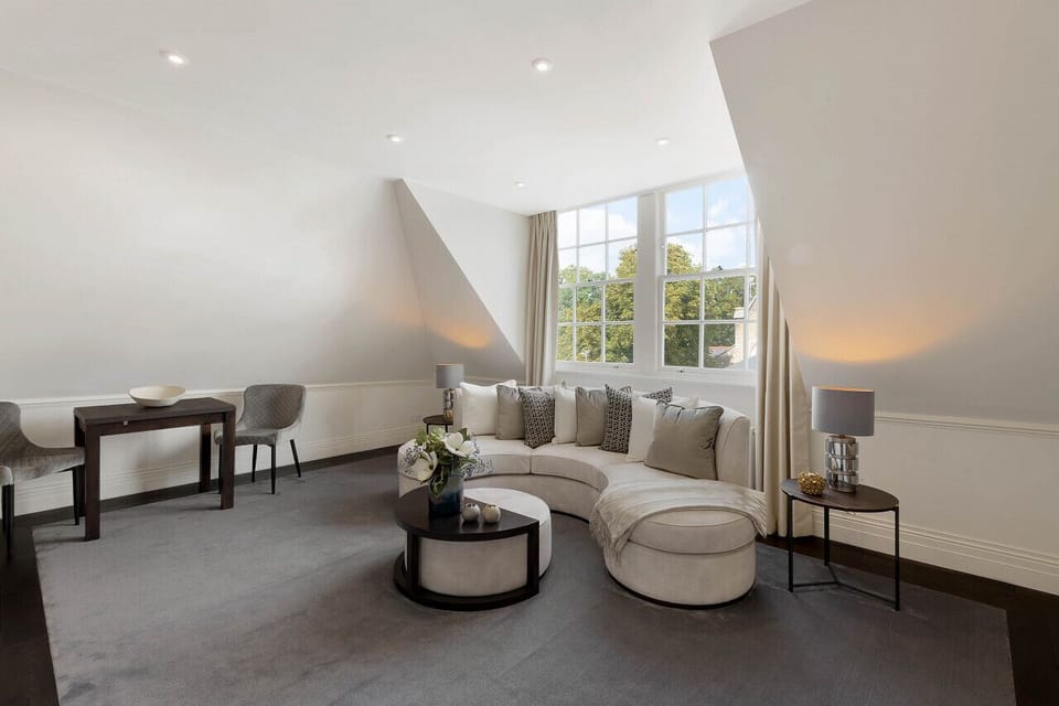 Dining area — quality carpet and hardwood floor finishes, fully equipped with dining utensils and a large Smart TV