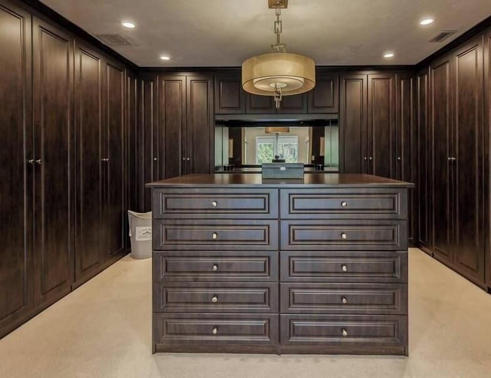 Primary Bedroom Walk in Closet with work out balls, weights & mats. 