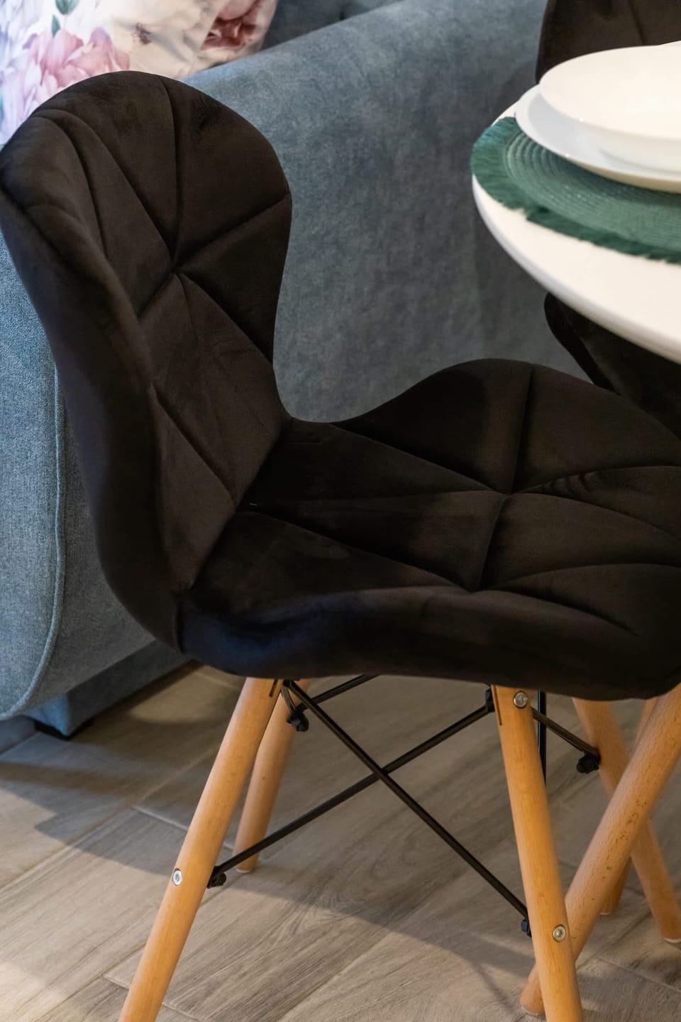 A stylish dining chair with a modern quilted design, blending comfort and elegance.

