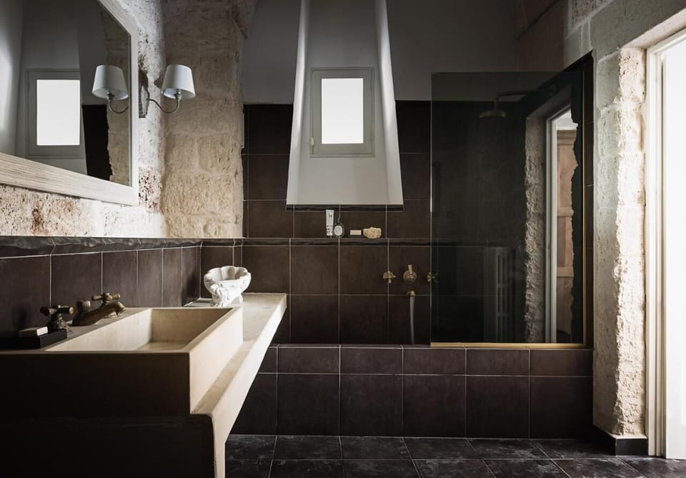 Designer toiletries, hair dryer, bathrobes, slippers