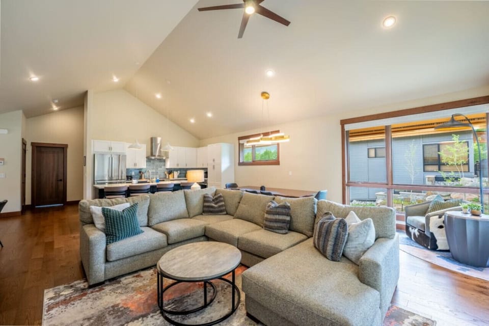 Open concept kitchen, dining and living areas