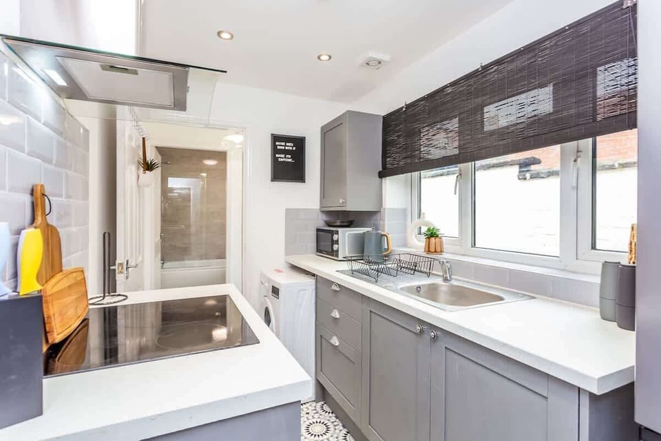 Family-friendly kitchen oasis equipped with all essentials, including a washer & dryer, oven, fridge and full cookware set. Plus, thoughtful touches like children's dinnerware ensure everyone feels right at home in this cozy culinary haven.

