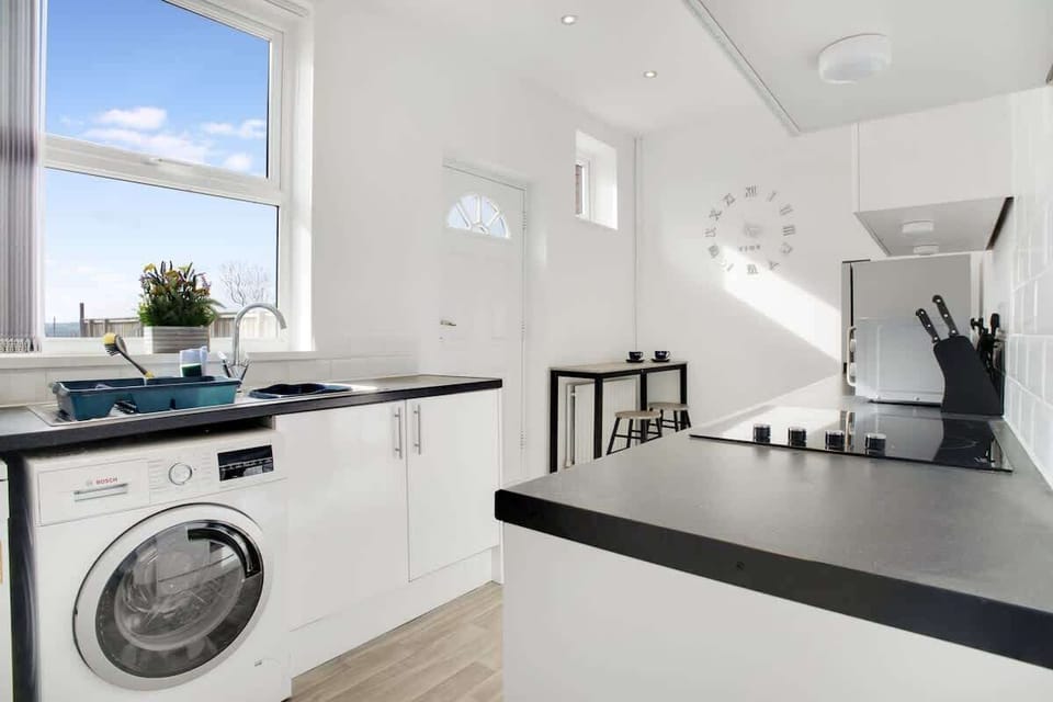 Family-friendly kitchen oasis equipped with all essentials, including a washer & dryer, oven, fridge and full cookware set. Plus, thoughtful touches like children's dinnerware ensure everyone feels right at home in this cozy culinary haven.