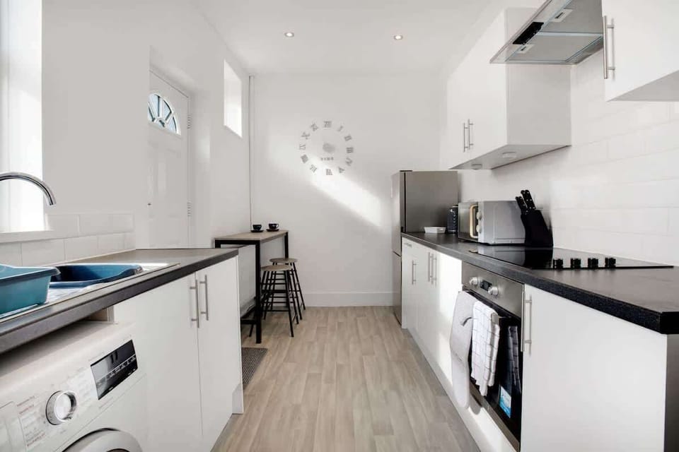 Family-friendly kitchen oasis equipped with all essentials, including a washer & dryer, oven, fridge and full cookware set. Plus, thoughtful touches like children's dinnerware ensure everyone feels right at home in this cozy culinary haven.