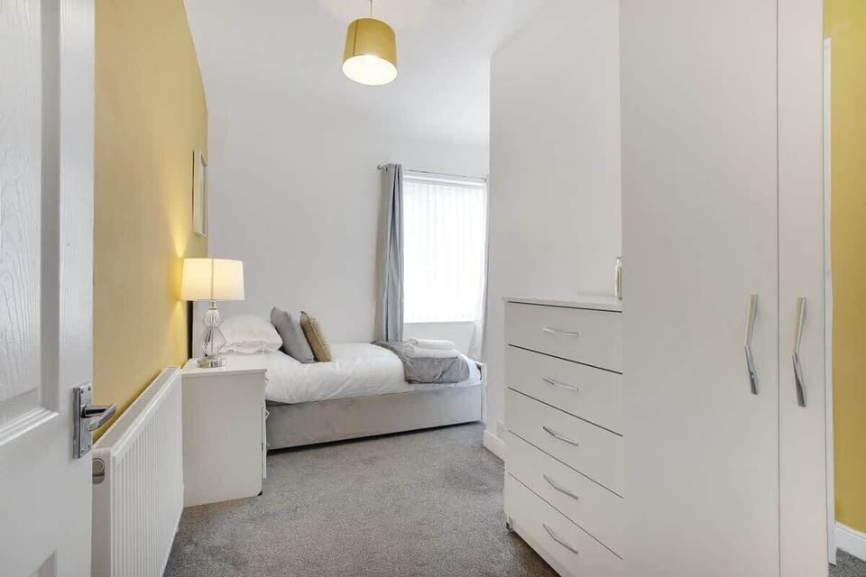 Designed for comfort and convenience, this welcoming room features a cosy single bed and plenty of storage space. An ideal retreat for both short and extended stays.