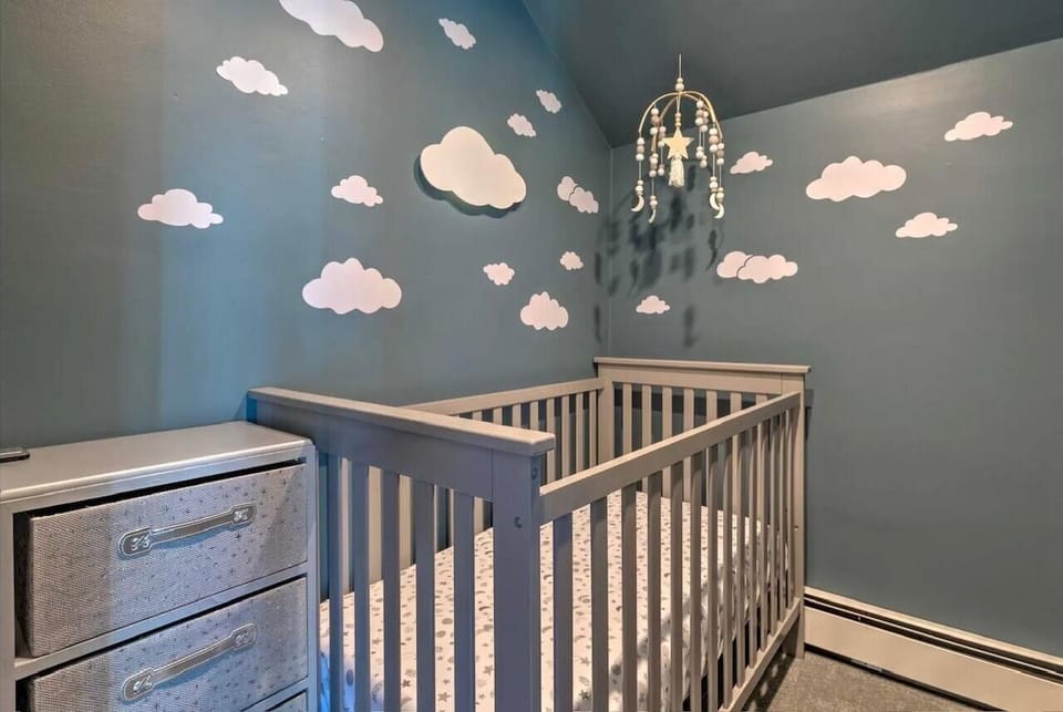 Crib located in primary bedroom upstairs