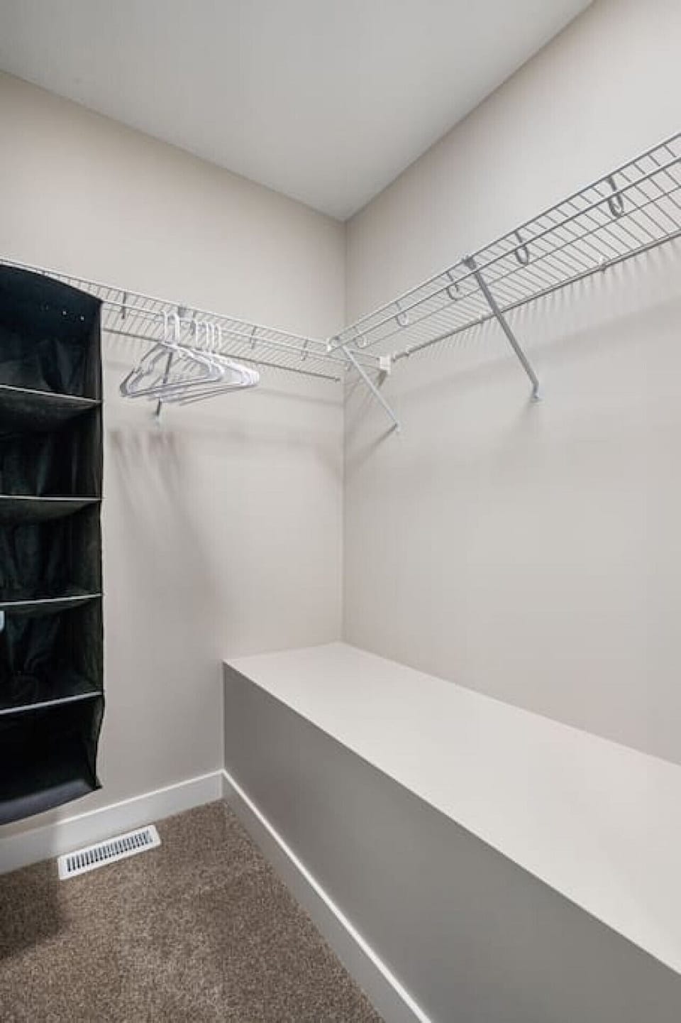 Primary bedroom, located upstairs, with a queen bed, closet, blackout curtains, and a private ensuite bathroom.