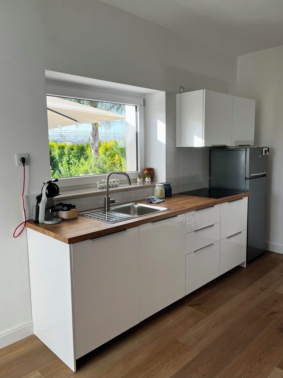 Comfort Villa | Private kitchen | Full-size fridge, stovetop, electric kettle, cookware/dishes/utensils