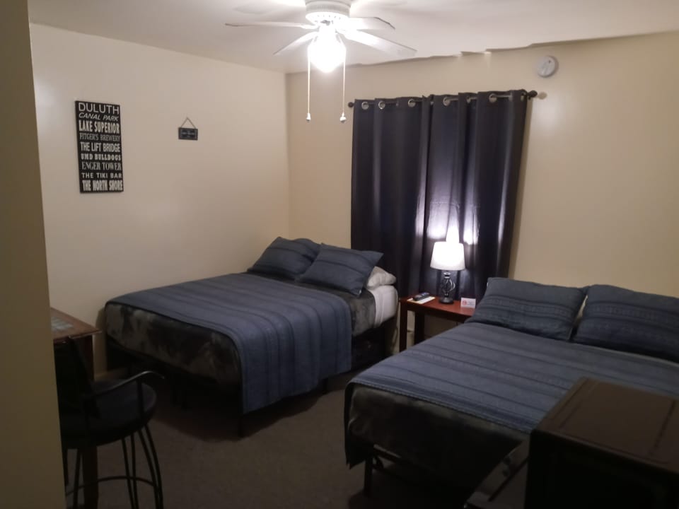 Basic Room, 2 Double Beds, Refrigerator | Desk, blackout drapes, iron/ironing board (on request), WiFi (free)