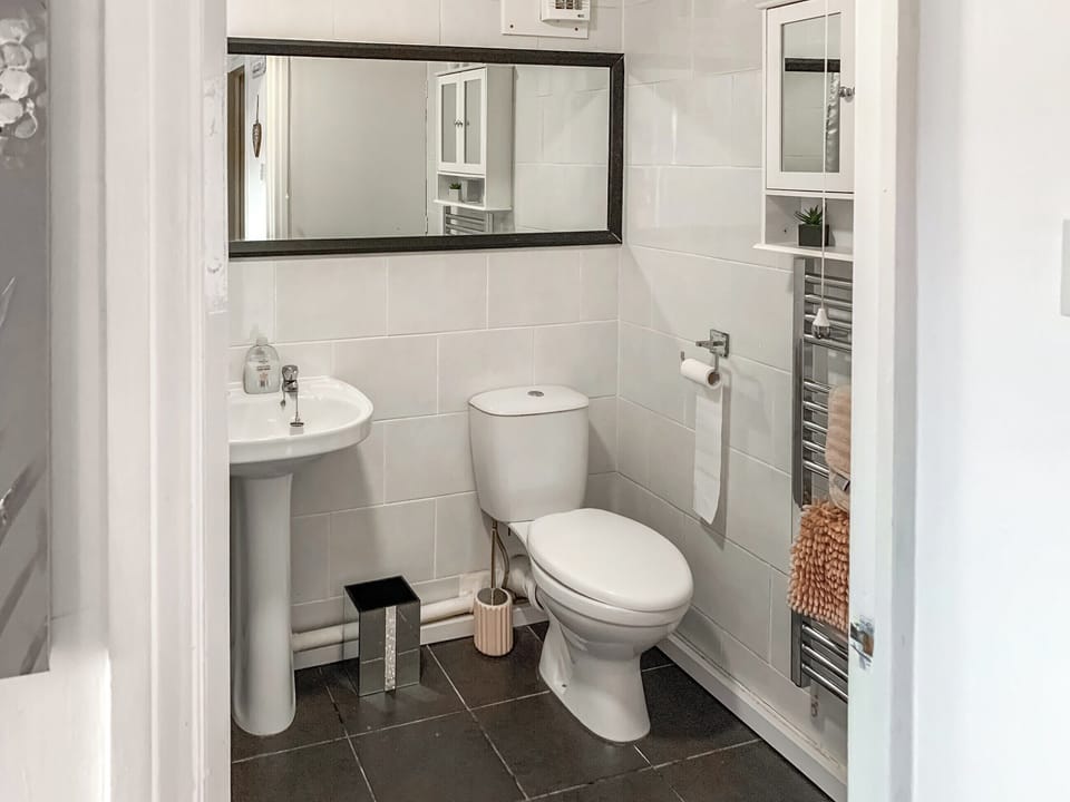 Bathroom | Sunny Rhyl Apartment - Sunny Properties, Rhyl