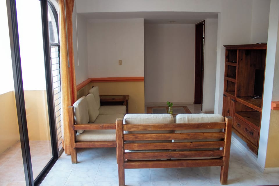 Classic Suite | Living area | 19-inch flat-screen TV with cable channels