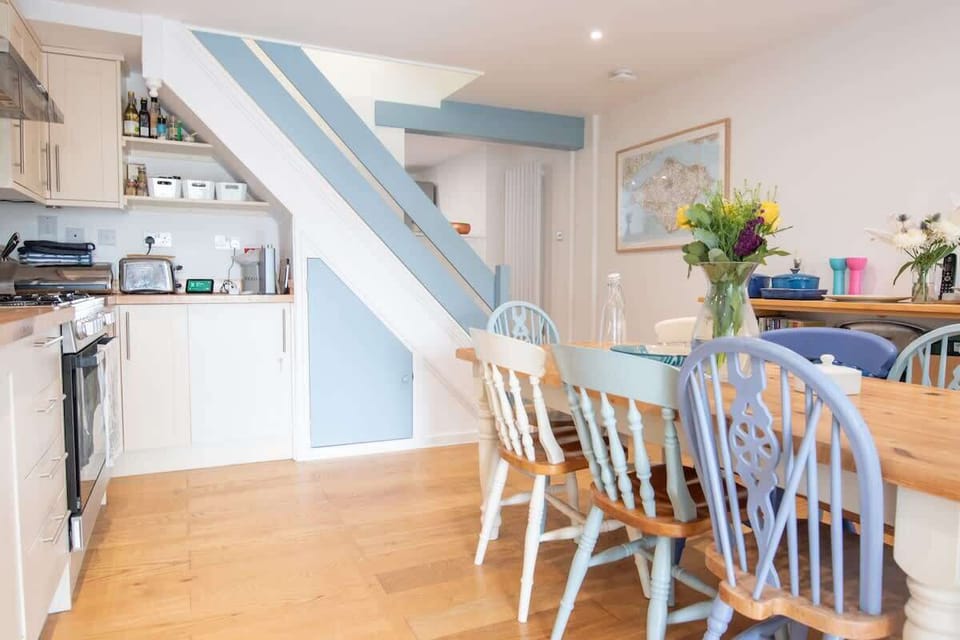 Well-equipped lower ground floor open-plan kitchen and utility room with WC. 