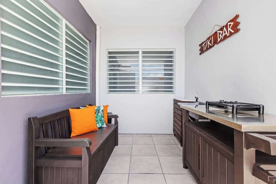 Tropical tranquility awaits you in this inviting living room.