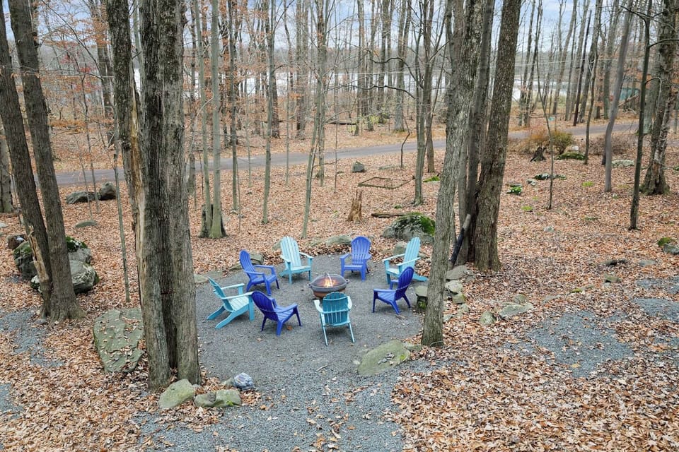 Aerial view of our quiet street, lake, and spacious fire pit area.