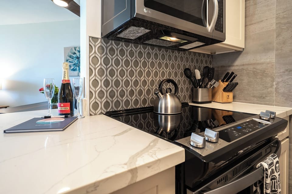 Luxury Condo | Private kitchen | Full-size fridge, microwave, oven, stovetop