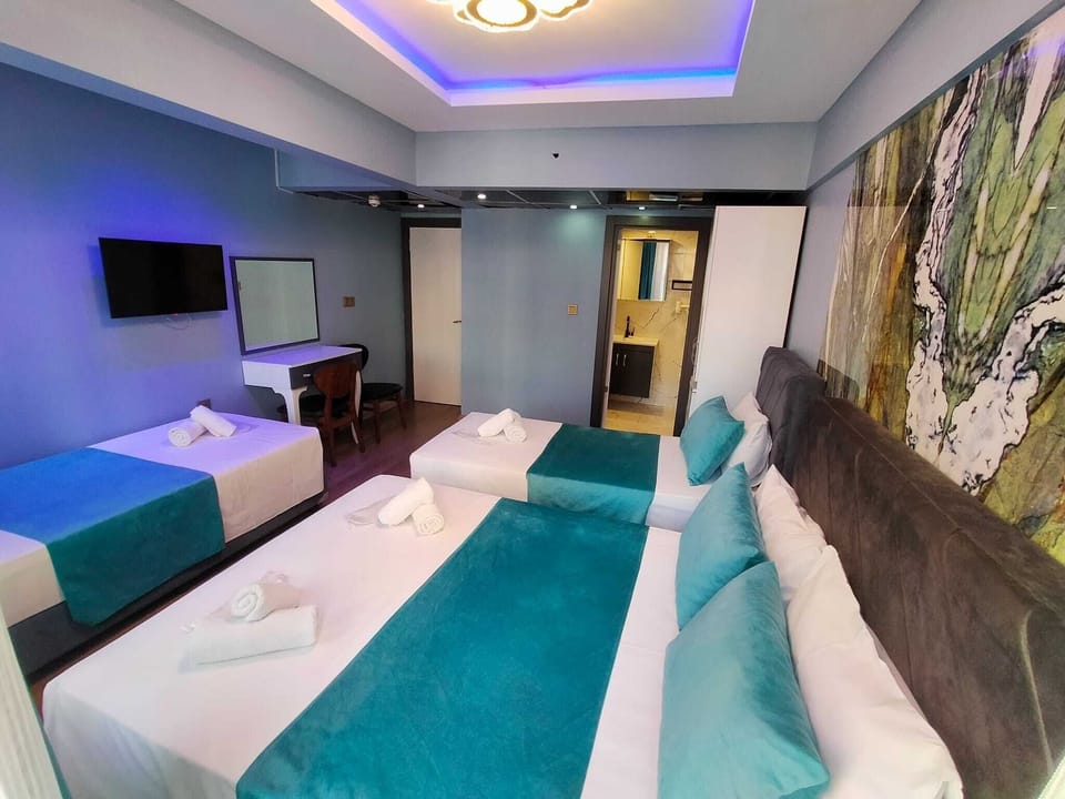 Comfort Quadruple Room, City View | Minibar, soundproofing, free WiFi, bed sheets