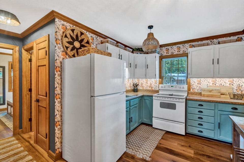 Efficiently designed kitchen with smart storage solutions in a charming, compact space.
