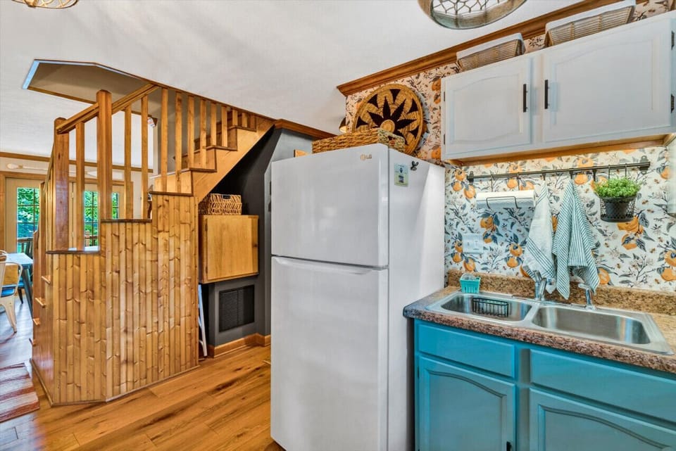 Efficiently designed kitchen with smart storage solutions in a charming, compact space.