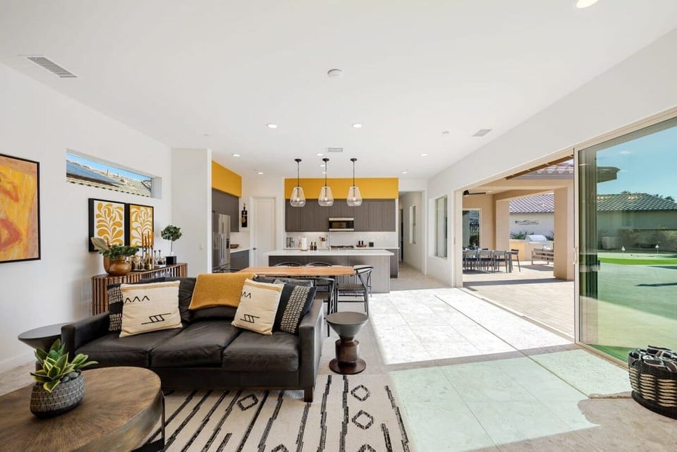 Living room area with views of the sunny outdoors.