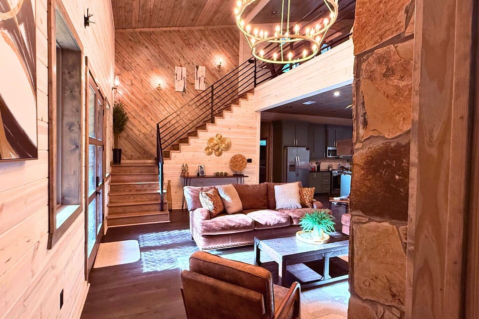 Living Room: Stylish space with a stone staircase, modern decor, and warm natural light!
