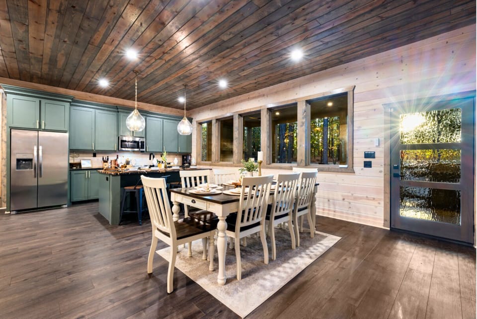 Dining Area: Bright windows invite nature in, perfect for feasting and creating memories together!