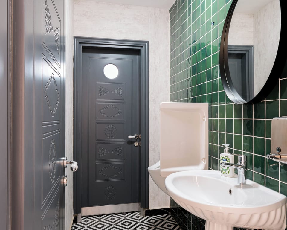 Shower, designer toiletries, hair dryer, slippers