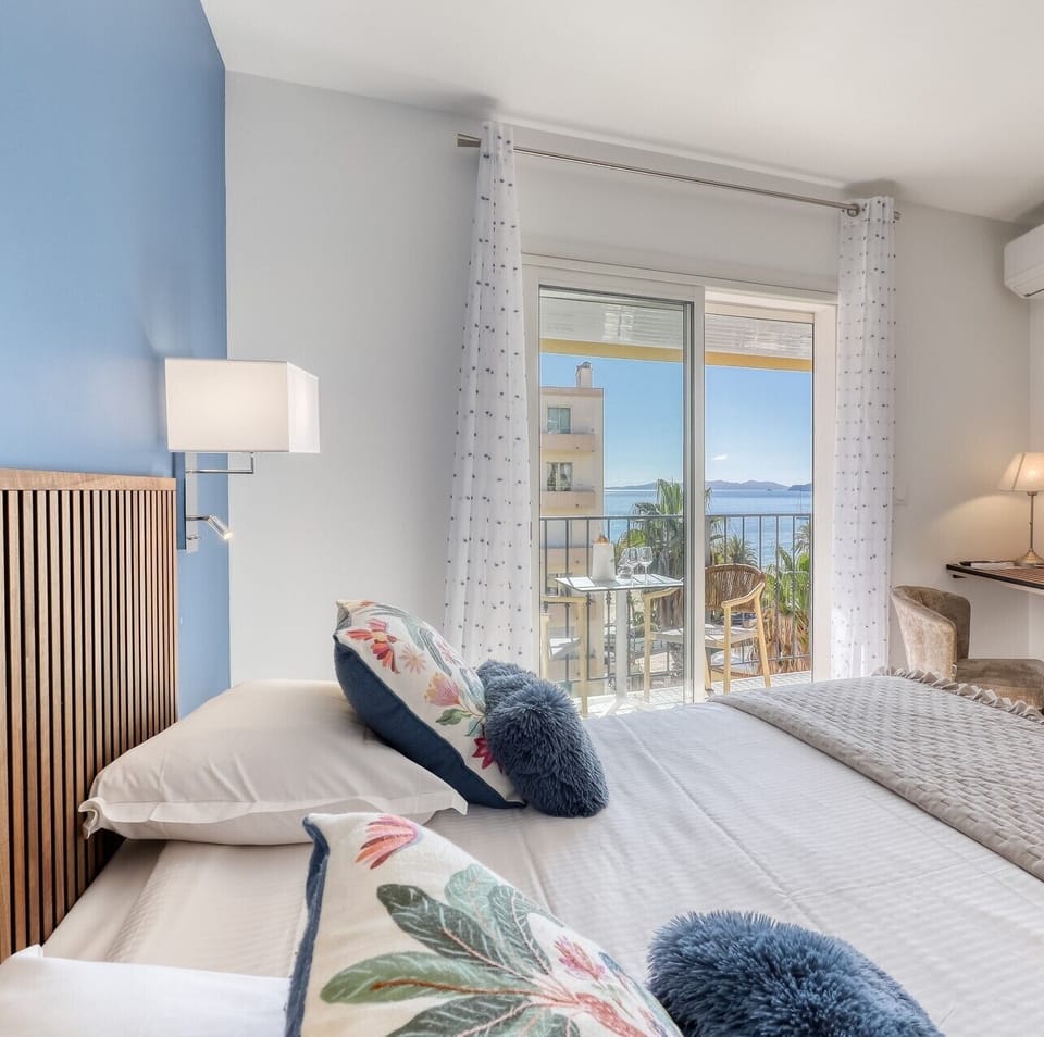Superior Double or Twin Room, Partial Sea View | Minibar, in-room safe, desk, laptop workspace