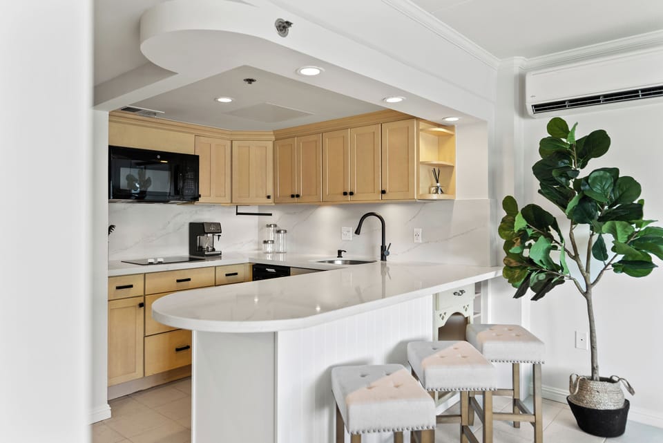 Kitchenette with refrigerator, microwave, coffee maker